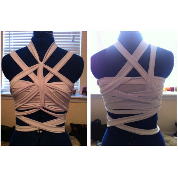 the back of a woman's top is covered in strips of white fabric and tied together