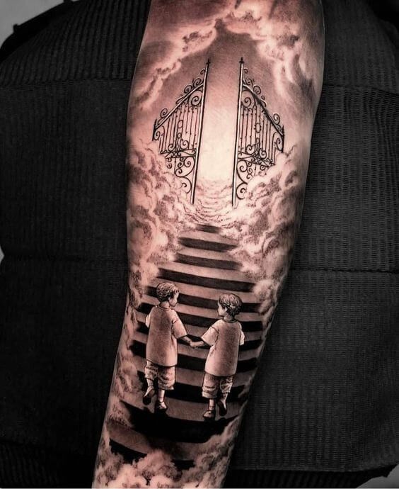 a man with a tattoo on his arm that has stairs leading up to the sky