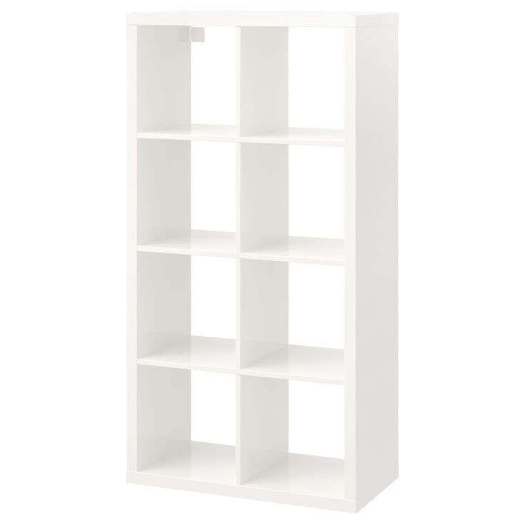 a white bookcase with four shelves on each side