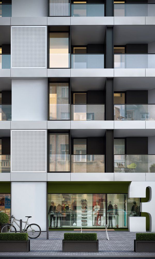 an apartment building with multiple balconies and people walking in the front door area