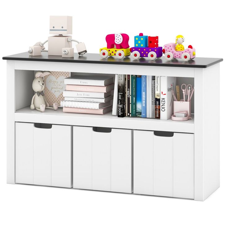 a toy train is sitting on top of a book shelf next to some books and toys