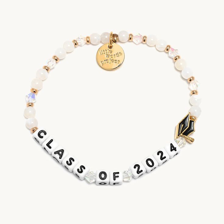 Here's to the Class of 2024! Gift your grad with a white beaded bracelet that reminds them to chase their dreams every day. Handcrafted with a custom-casted graduation cap charm. • Hand-crafted, acrylic beaded bracelet• Plated brass hardware• Elastic stretch bracelet• Handle with care - do not wet• Prop 65 compliant