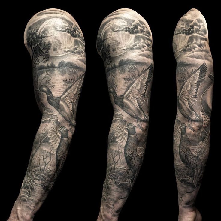 the legs and arms of a man with tattoos on them, both covered in grey ink