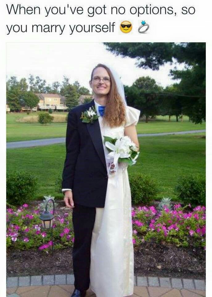 a man and woman dressed up in formal wear standing next to each other with flowers