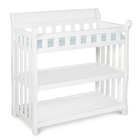 a white wooden baby crib with two shelves on the bottom and one shelf below it