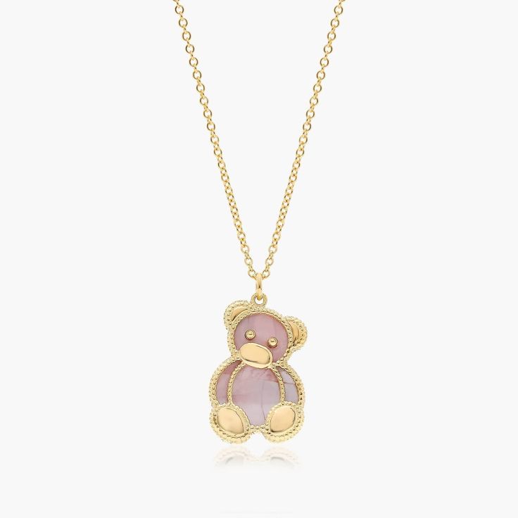 a pink teddy bear necklace on a gold chain