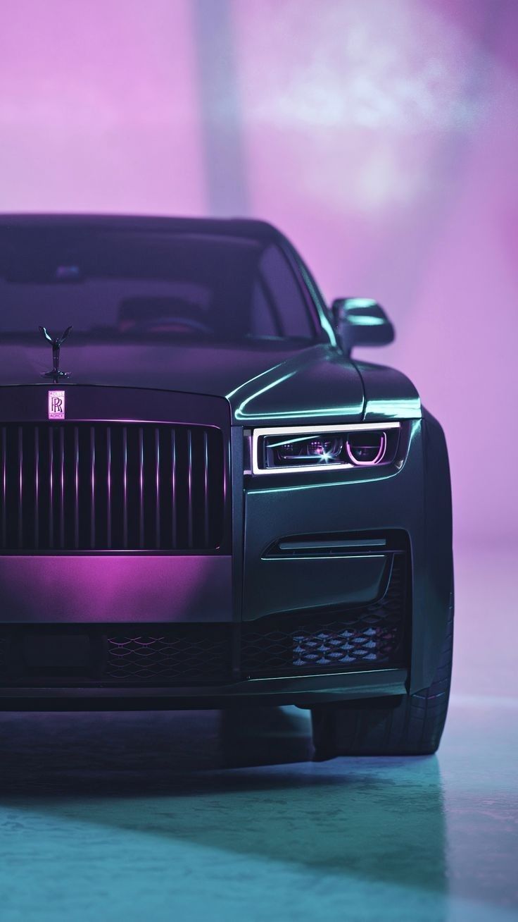 the front end of a black car on a purple background