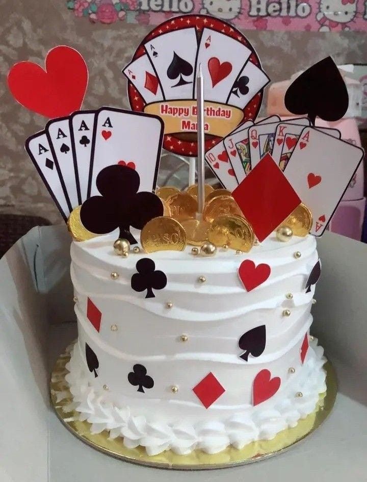 a birthday cake with playing cards on it