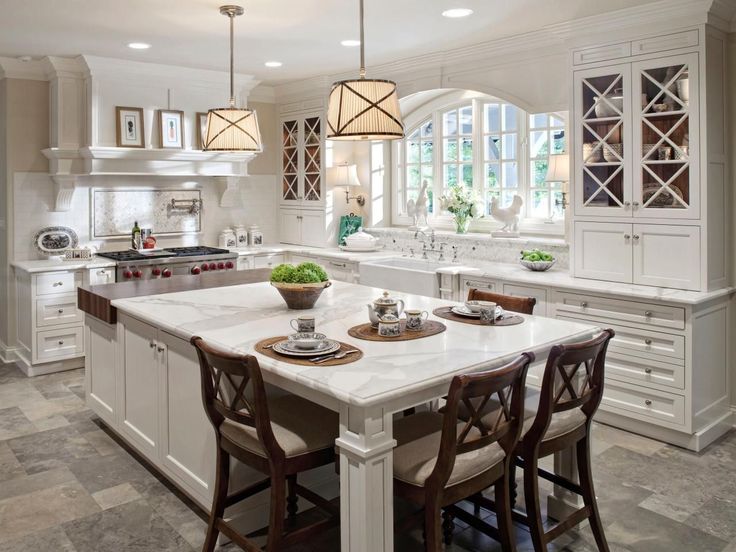 a large kitchen with an island in the middle