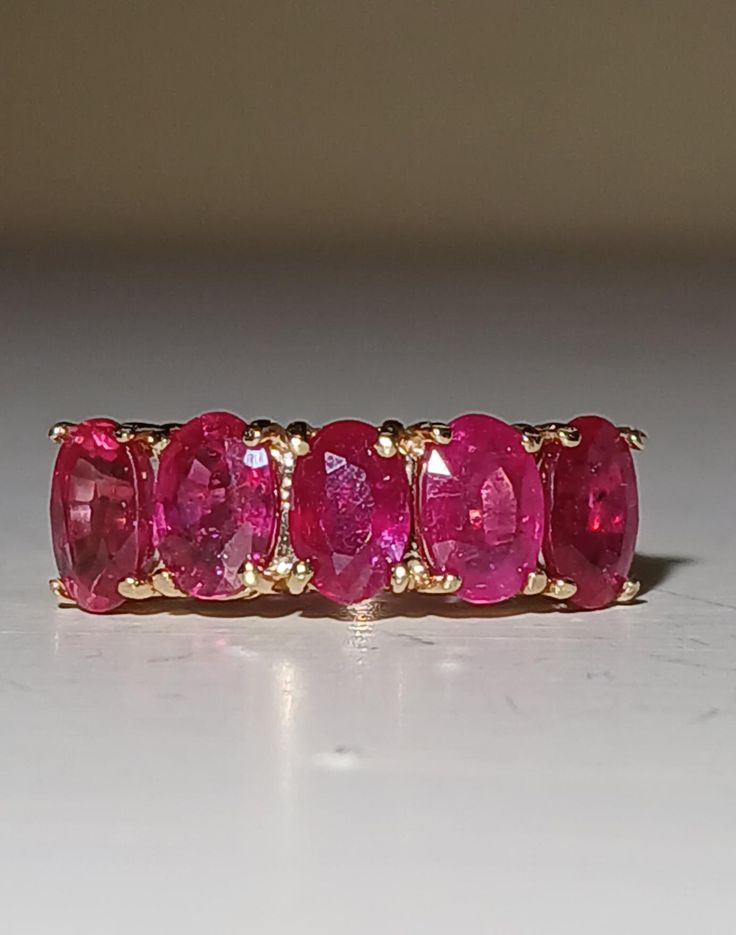 a pink ring sitting on top of a table