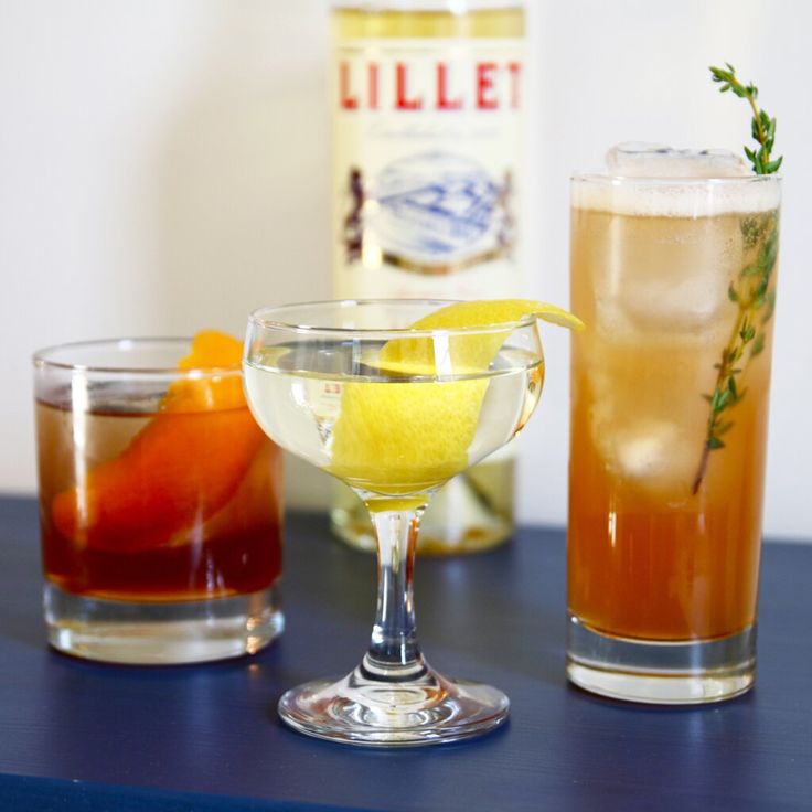 two glasses filled with different types of drinks