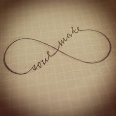 the word love is written in cursive writing