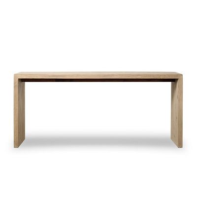 the table is made from wood and has a long, narrow top with no legs