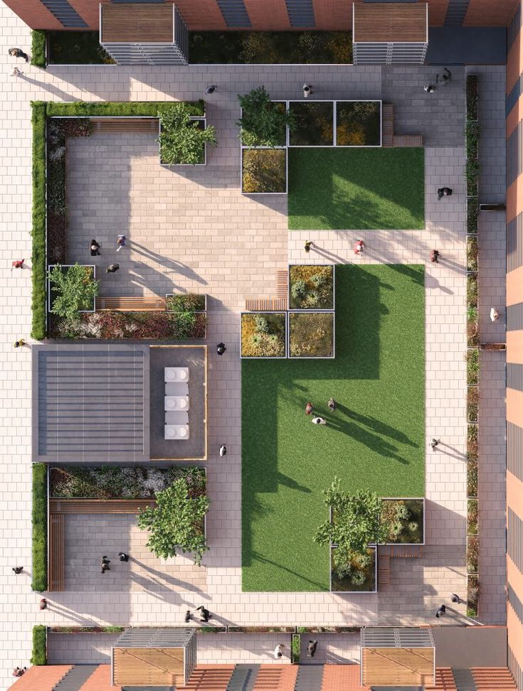 an aerial view of a park with benches and grass