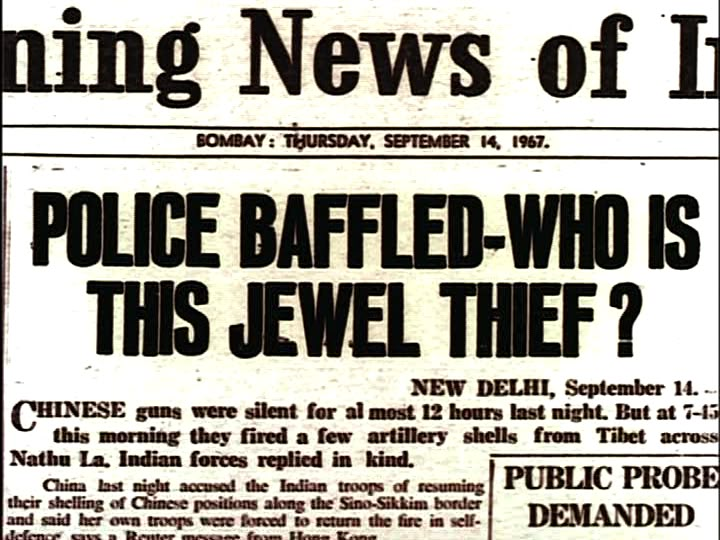 the front page of an old newspaper with news on police baffled - who is this jewel thief?