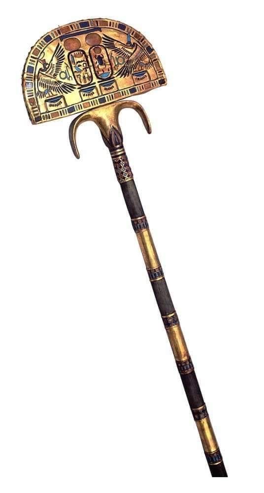 an ancient looking hammer with egyptian designs on it