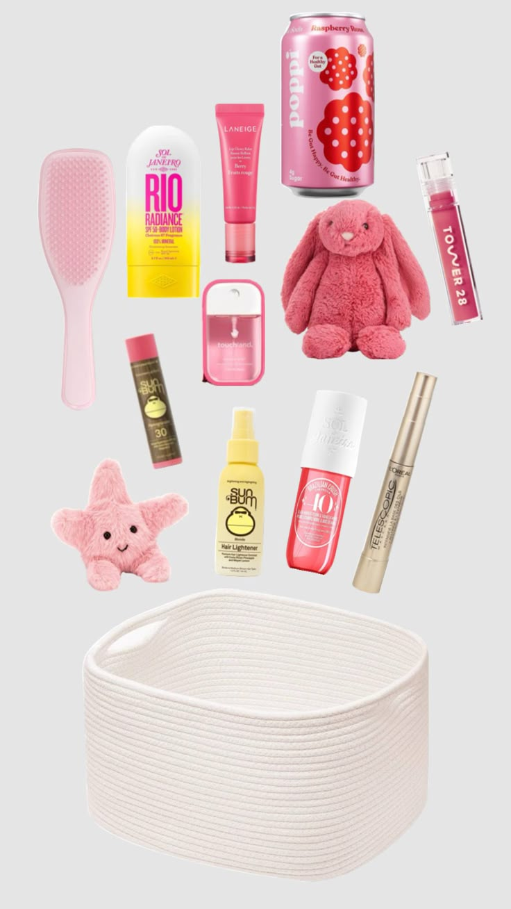 the contents of a white basket with pink stuff on it and other items surrounding them