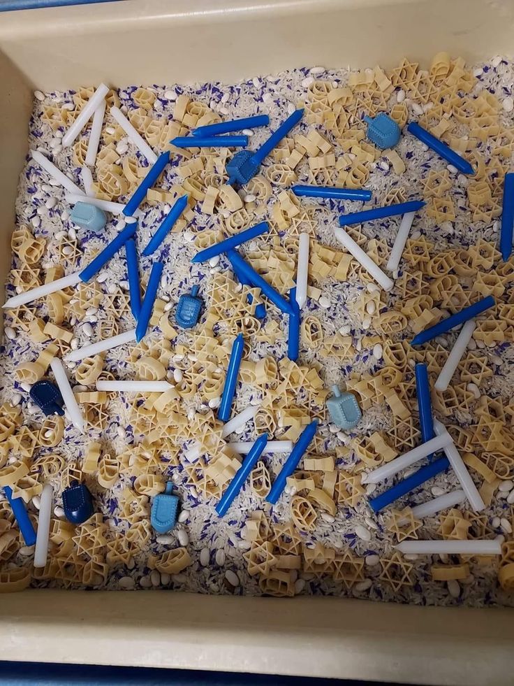 a box filled with blue and white toothpicks