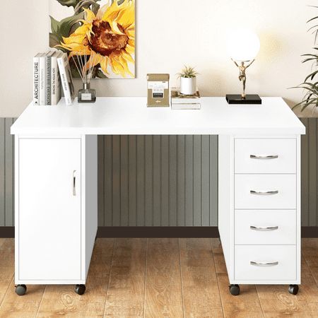 a white desk with three drawers and a sunflower on the wall behind it in a room