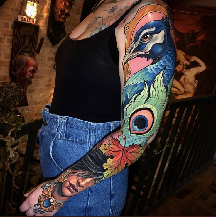 a woman with colorful tattoos on her arm