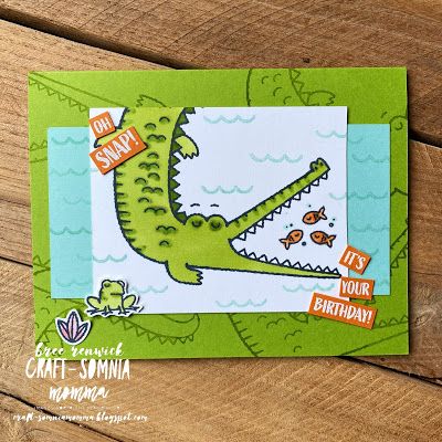 a handmade card with an alligator on it