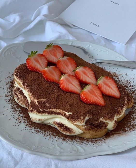 a cake with chocolate and strawberries on top