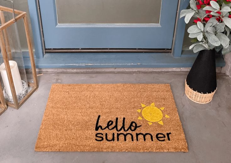 a door mat with the words hello summer on it