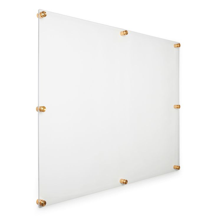 a white wall with gold studding on the edges and a square glass board in front