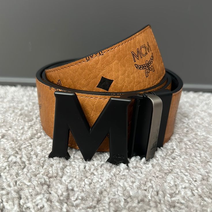 Mcm Small Brown Leather Belt With Black Metal Clasp. One Additional Hole Added To Adjust To A Smaller Size Waist. Worn 1 Time. Black And Gold Mens Belt, Mcm Belt, Cheap Brown Men's Belt, Brown Leather Belt, Leather Belt, Black Metal, Belts, Brown Leather, Black And Brown