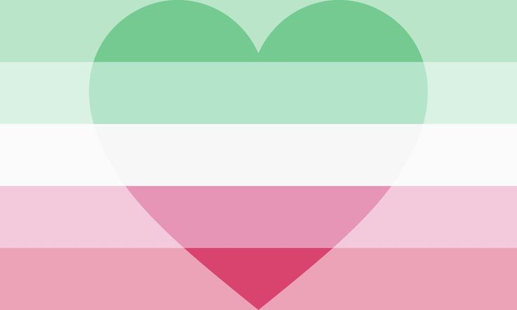 a heart shaped object is in the middle of a multi - colored striped wallpaper