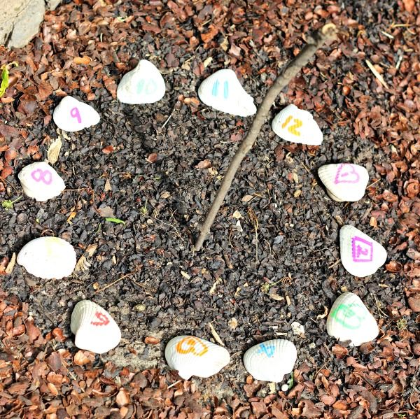 rocks arranged in the shape of a circle with numbers on them