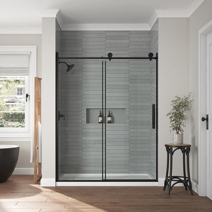 a bath room with a tub and a shower head mounted to it's side