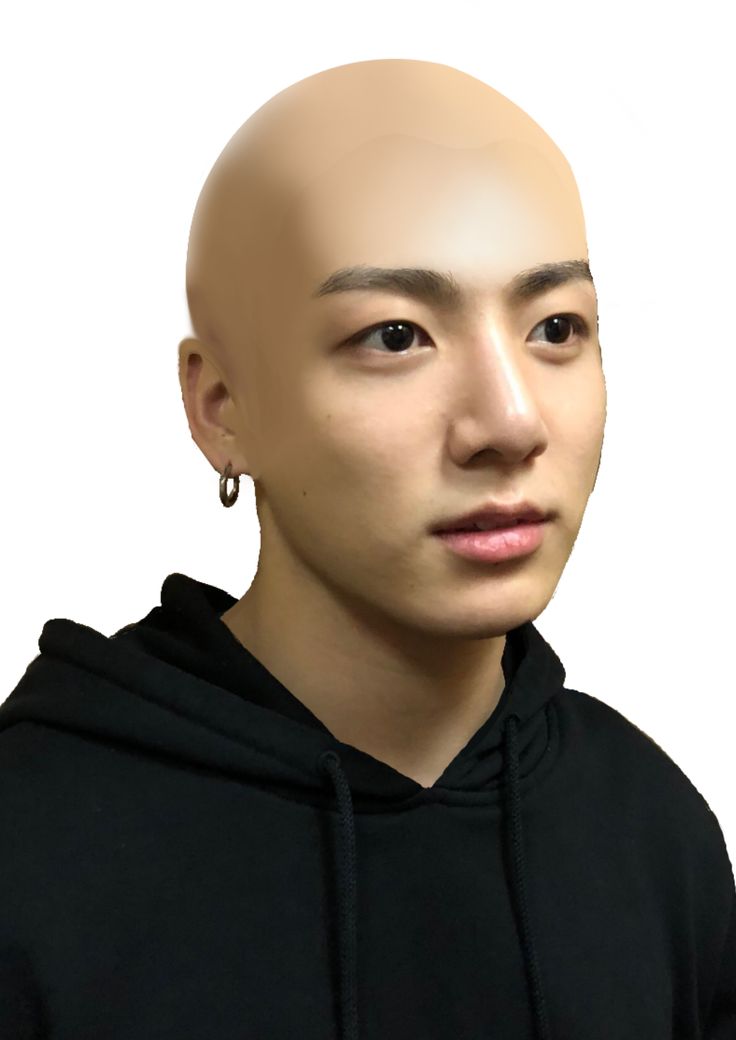 a man with a bald head wearing a black hoodie and ear piercings, looking at the camera