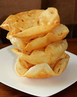 a stack of chips sitting on top of a white plate