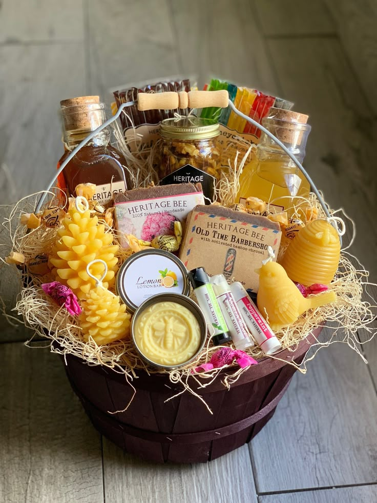 a basket filled with lots of different types of condiments and liquor in it