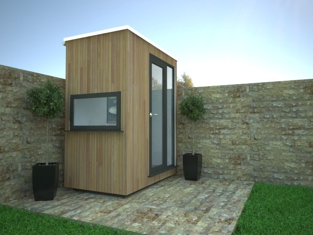 a small wooden building sitting on top of a grass covered field next to a brick wall