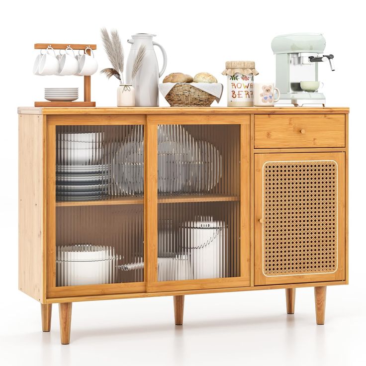 a wooden cabinet with dishes and cups on the top, next to an espresso machine