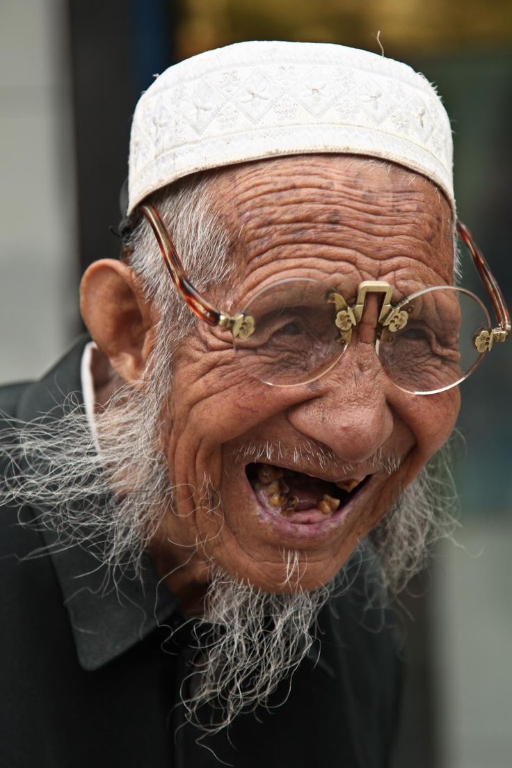 an old man with glasses and a white beard