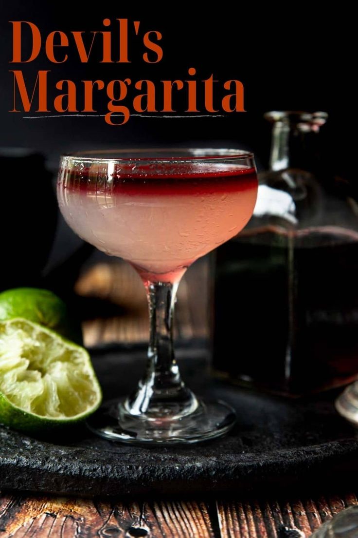 the devil's margarita cocktail is garnished with lime