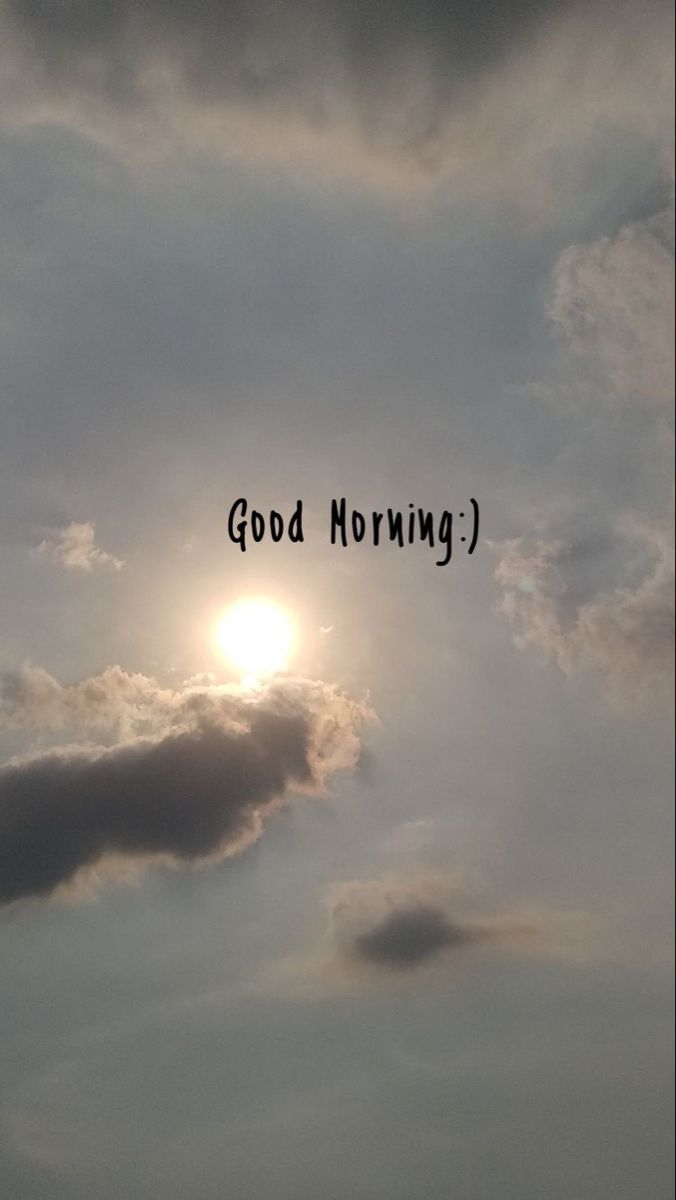 the words good morning are written in black on a cloudy sky with sun behind them