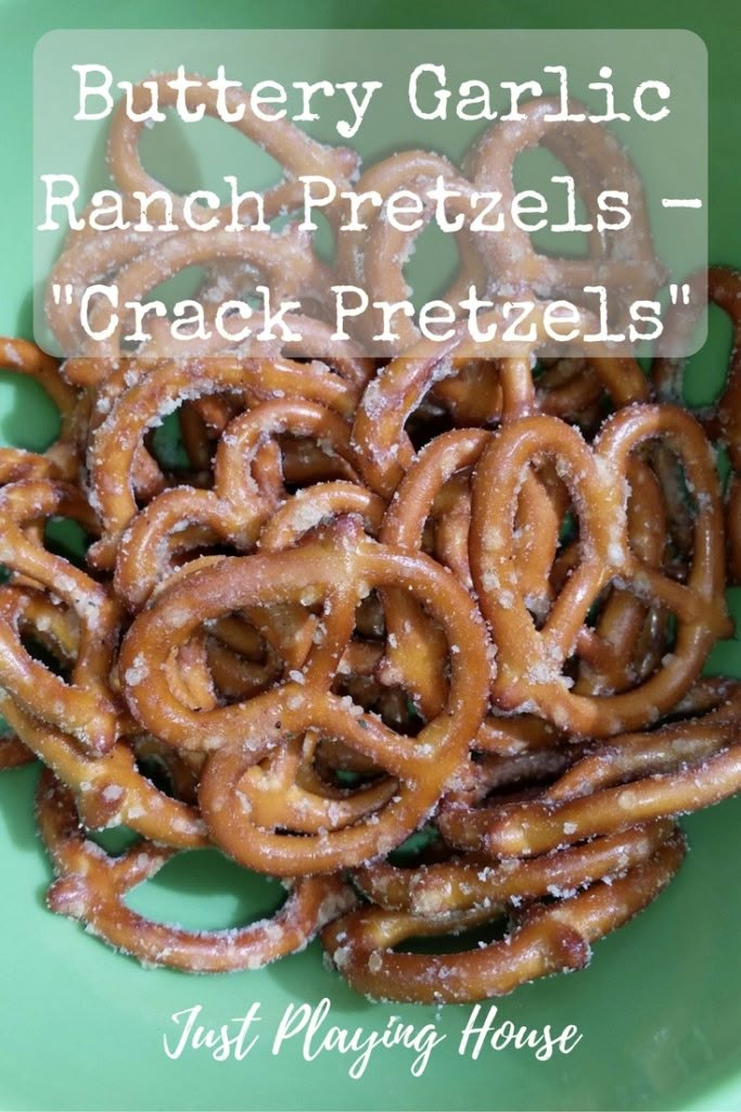 a green bowl filled with pretzels on top of a table