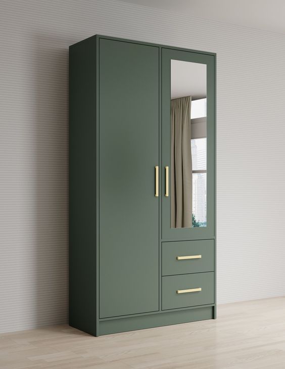 an empty room with a green armoire next to a white wall and wooden floor