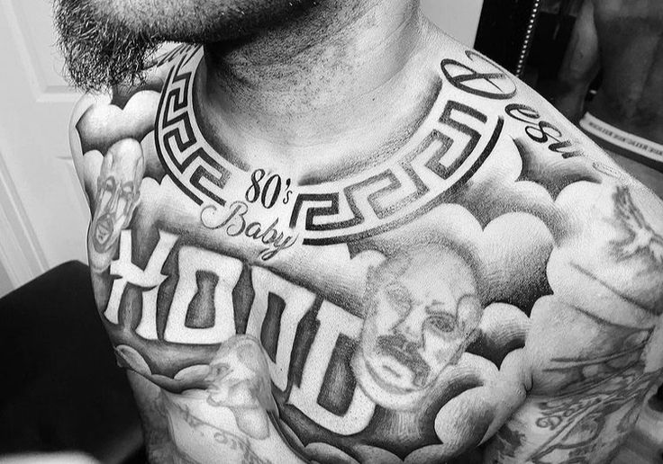 a man with some tattoos on his chest