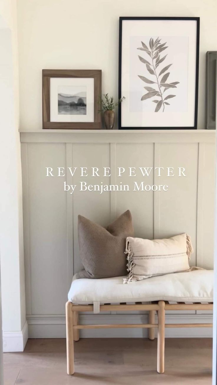 a white bench sitting in front of a wall with pictures above it and the words revere pewer by benjamin moore