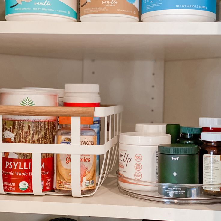 an organized pantry shelf filled with food and condiments, including yogurt