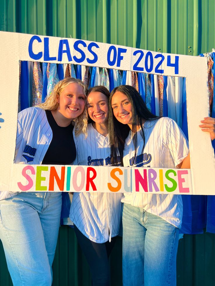 three girls are posing in front of a sign that says class of 202 senior nurse