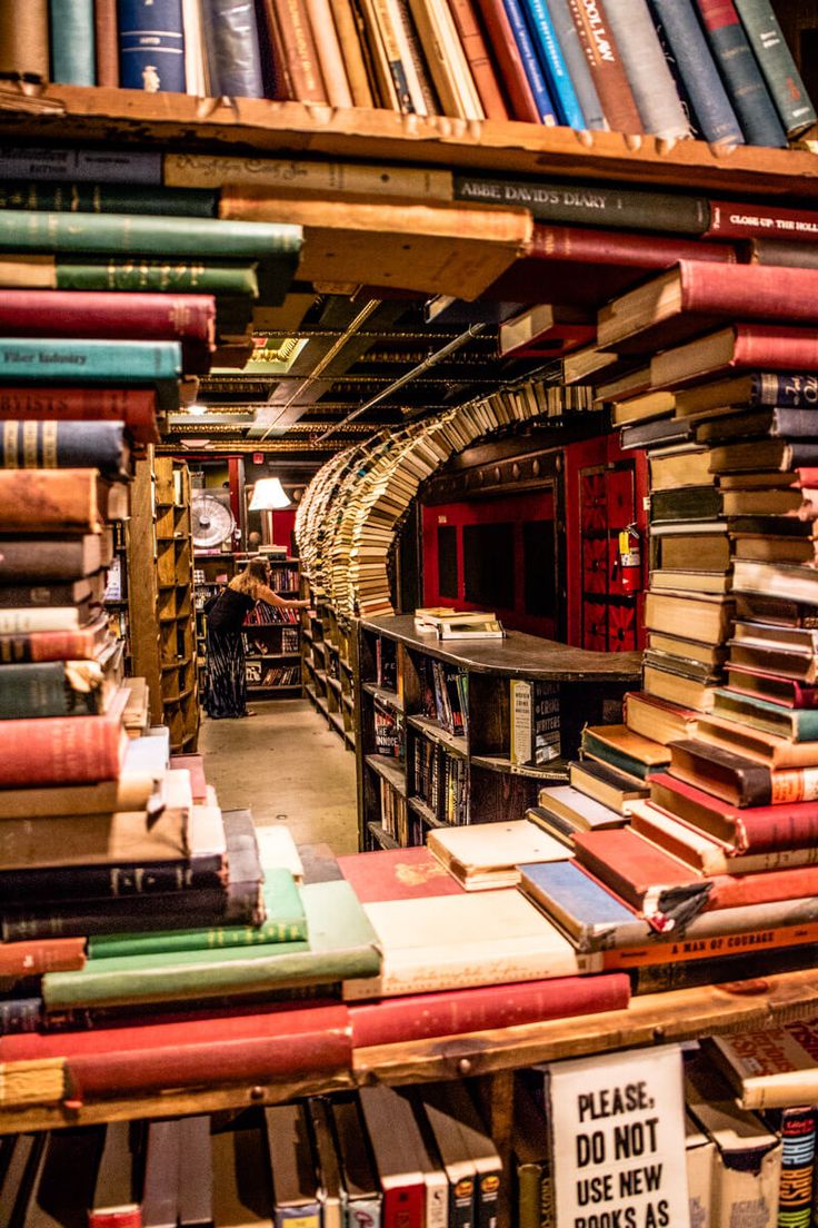 many books are stacked on top of each other