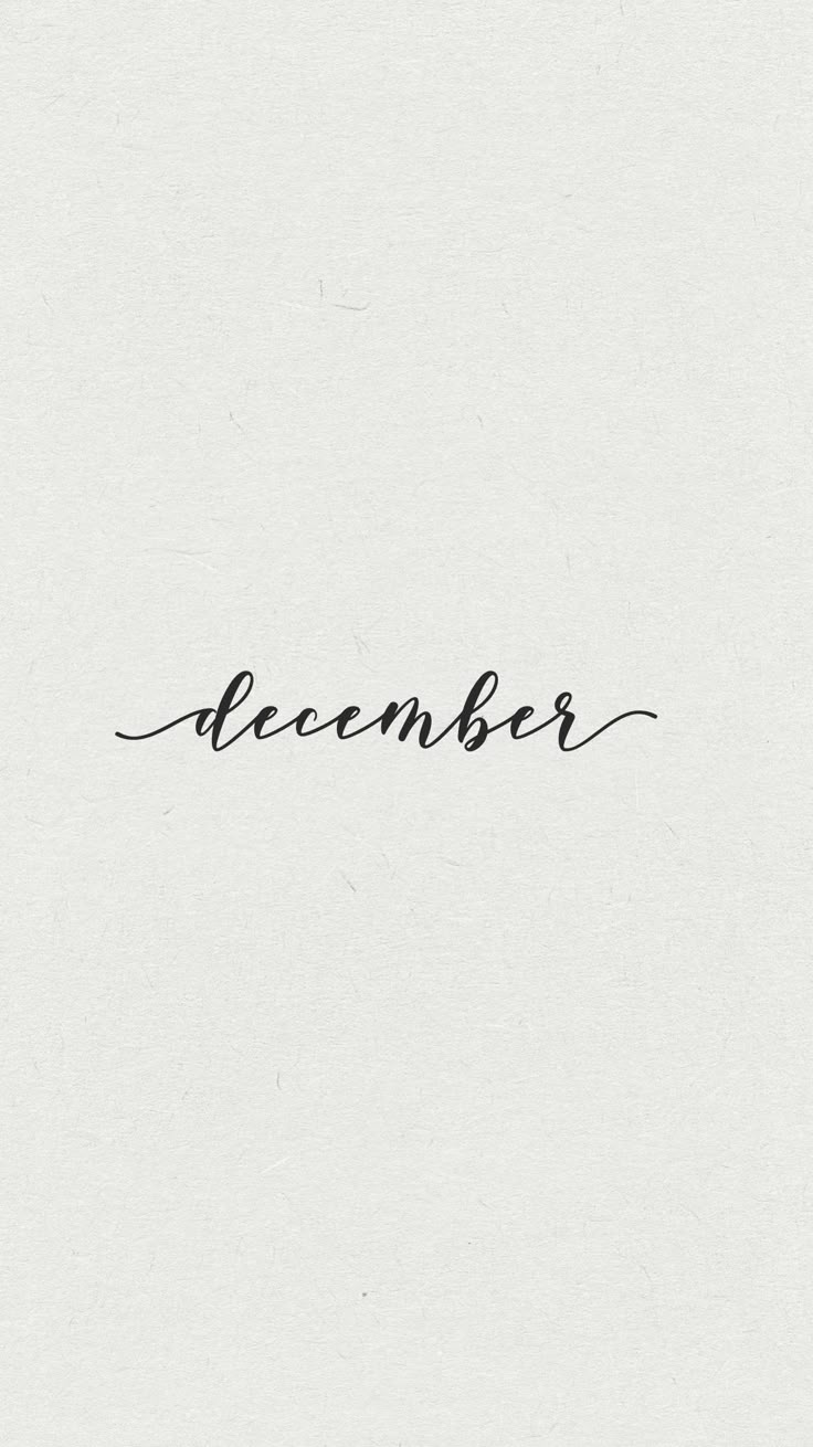 a black and white photo with the word december written in cursive writing on it