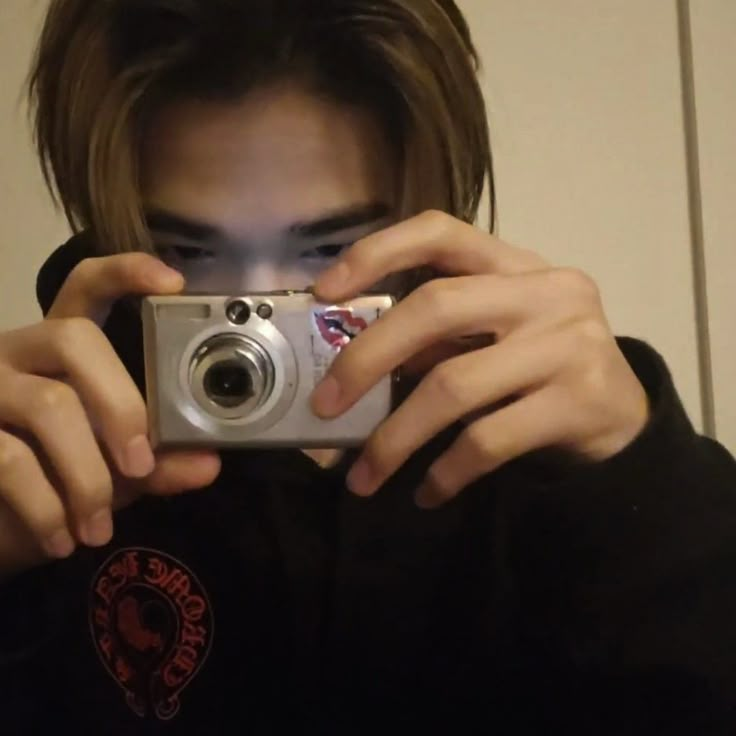 a person taking a photo with a camera