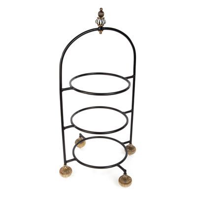 three tiered metal rack with seashells on the bottom and two circular shelves below